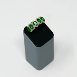Oval Emerald With Diamond Halo in Yellow Gold